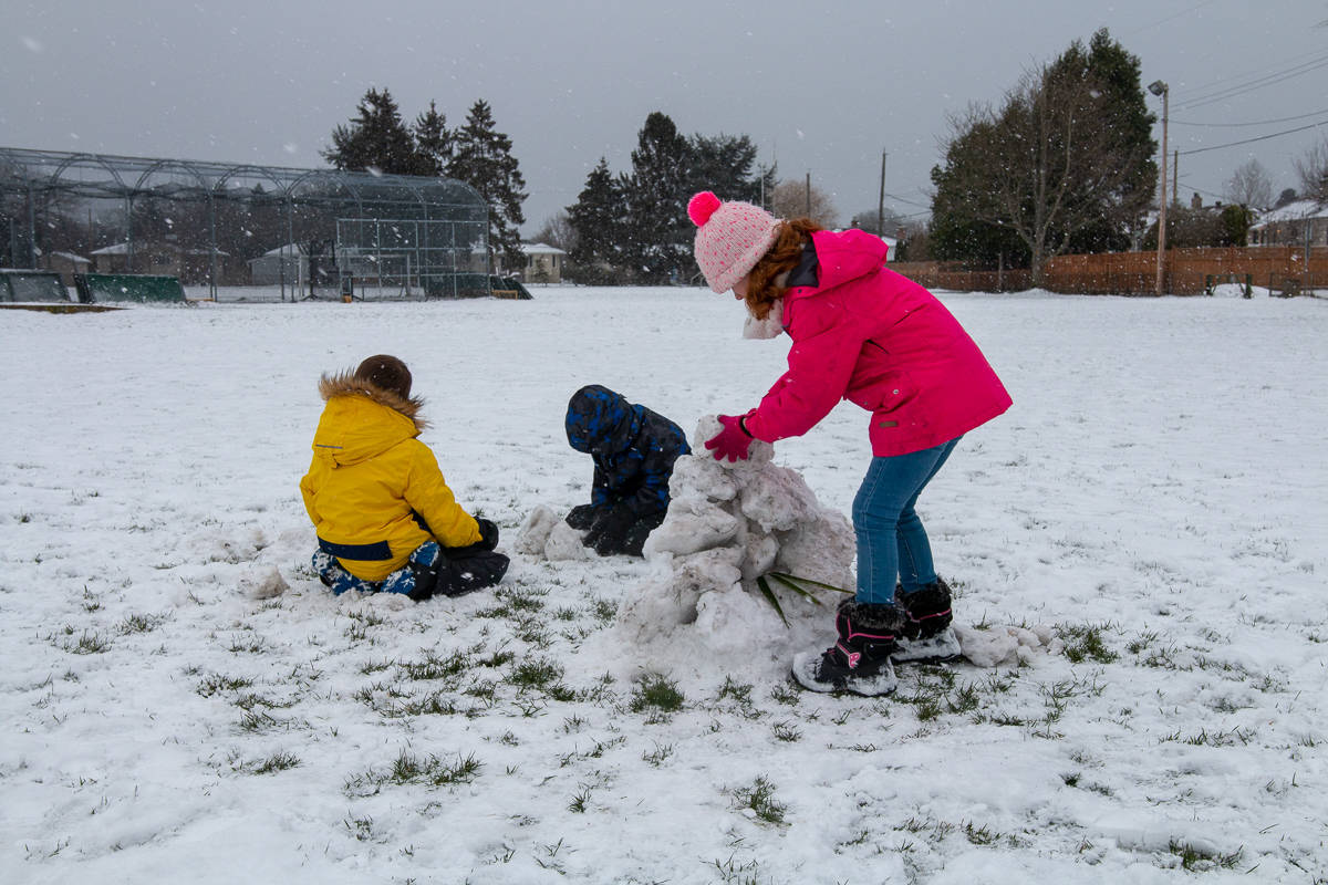 Kids enjoying the snow day by building a sculpture, Feb. 11, 2019. (Jesse Laufer / News Staff)