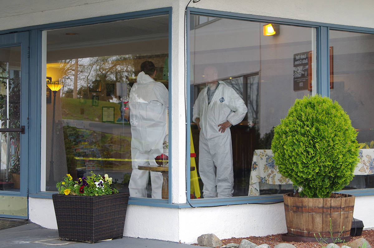 RCMP forensic investigators gather evidence in the lobby of the Howard Johnson Harbourside Hotel where a man was shot and killed in 2017. (News Bulletin file)
