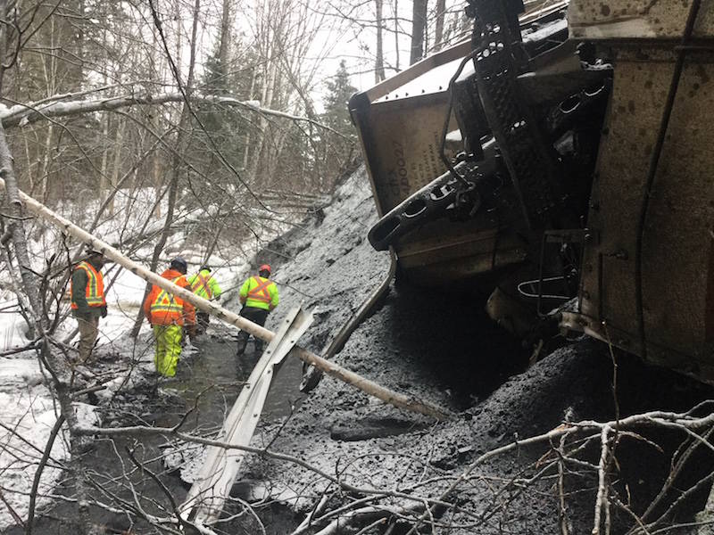 Crews survey the damage at the scene of a coal train derailment where 27 cars came off the track near New Hazelton, spilling some coal into Mission Creek. (Emergency Management B.C. photo)