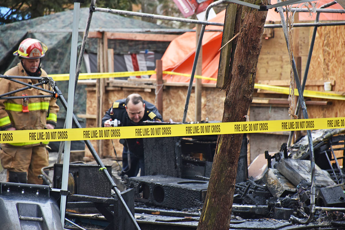 Fire Chief Howard Exner investigates the scene of Wednesday’s first fire at Anita Place Tent City. (THE NEWS/files)