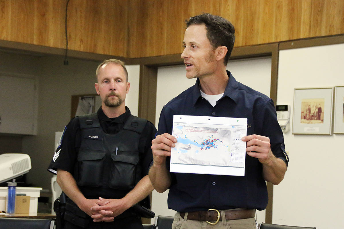 Wildlife-based problems prompt many calls to conservation officers, as WildSafe’s Todd Carnahan, right, and conservation officer, Sgt. Scott Norris, show on a map. (Lexi Bainas/Gazette file)