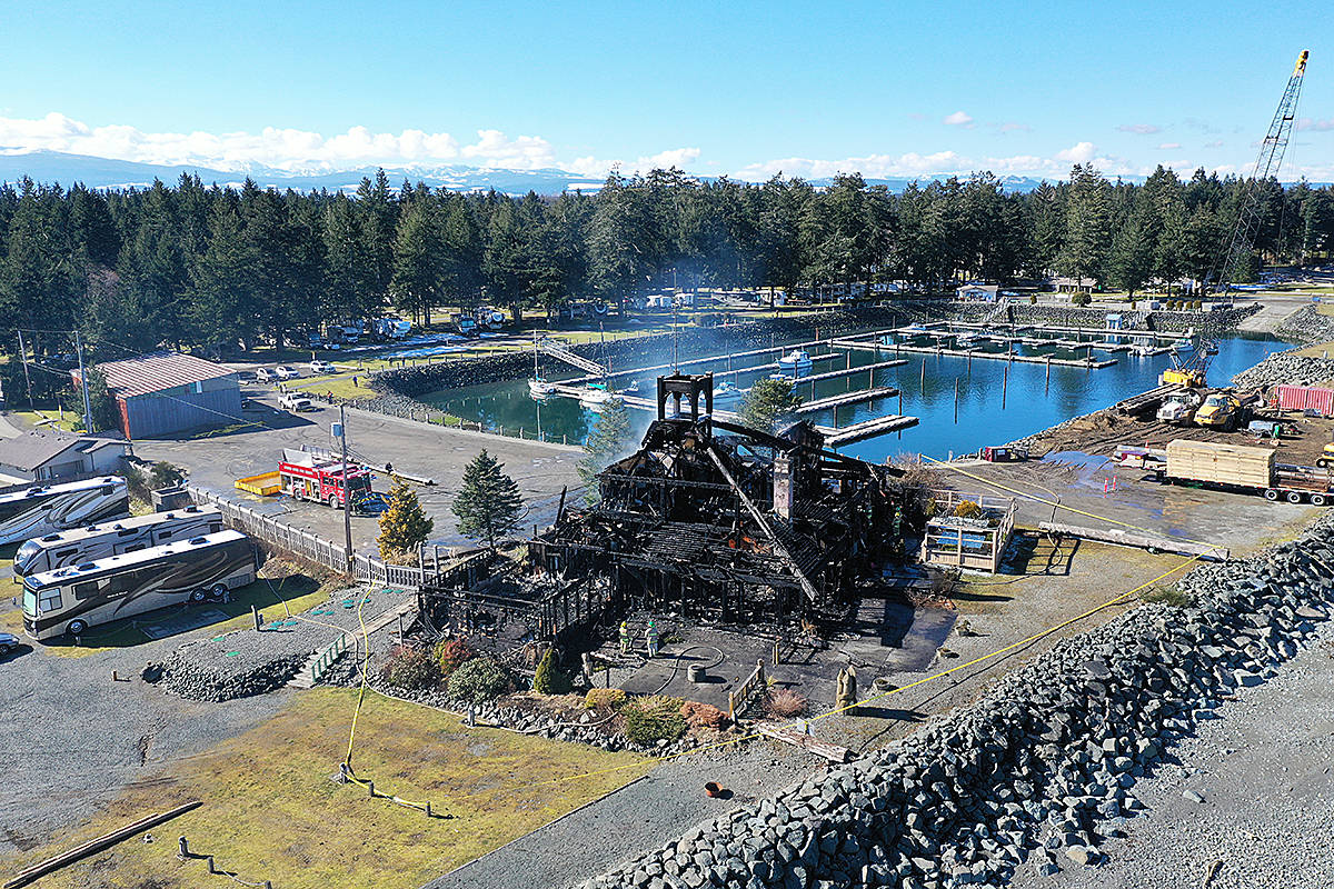 The Salmon Point Restaurant and Pub lies smouldering while firefighters conduct clean-up operations following a March 1 blaze. An investigation has traced the fire to the upper dining area. Photo by Curtis Papove