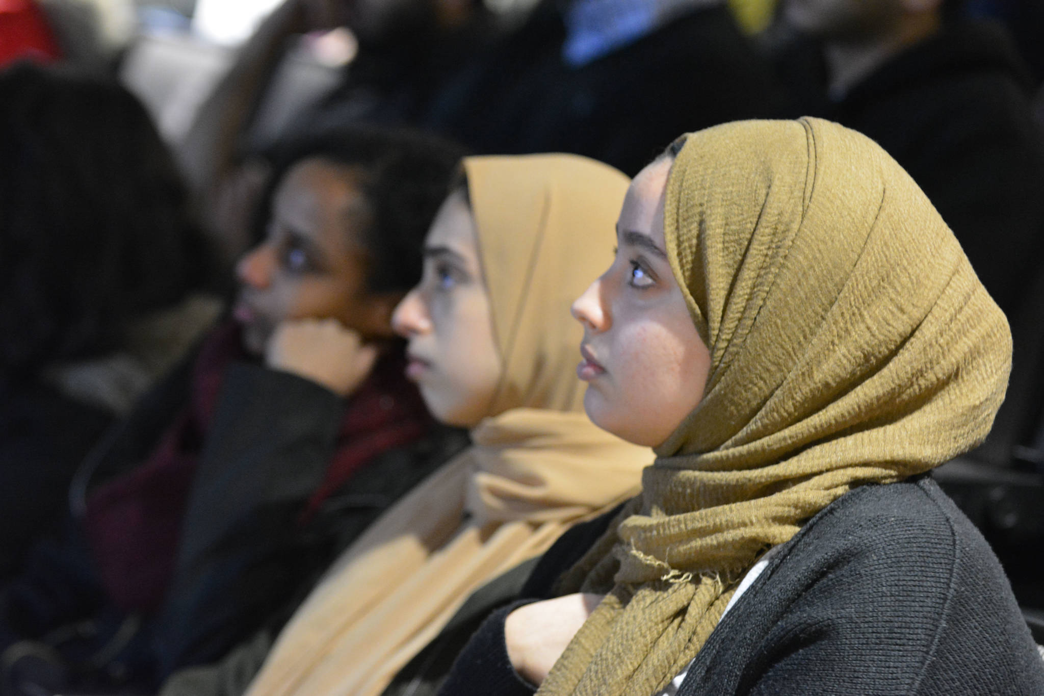 Sumbul Kiyani and Roaa Ramadan watch a slide show of the 50 victims killed in a mass shooting in Christchurch, New Zealand at UBC Okanagan Campus March 18. Sydney Morton/ Capital News