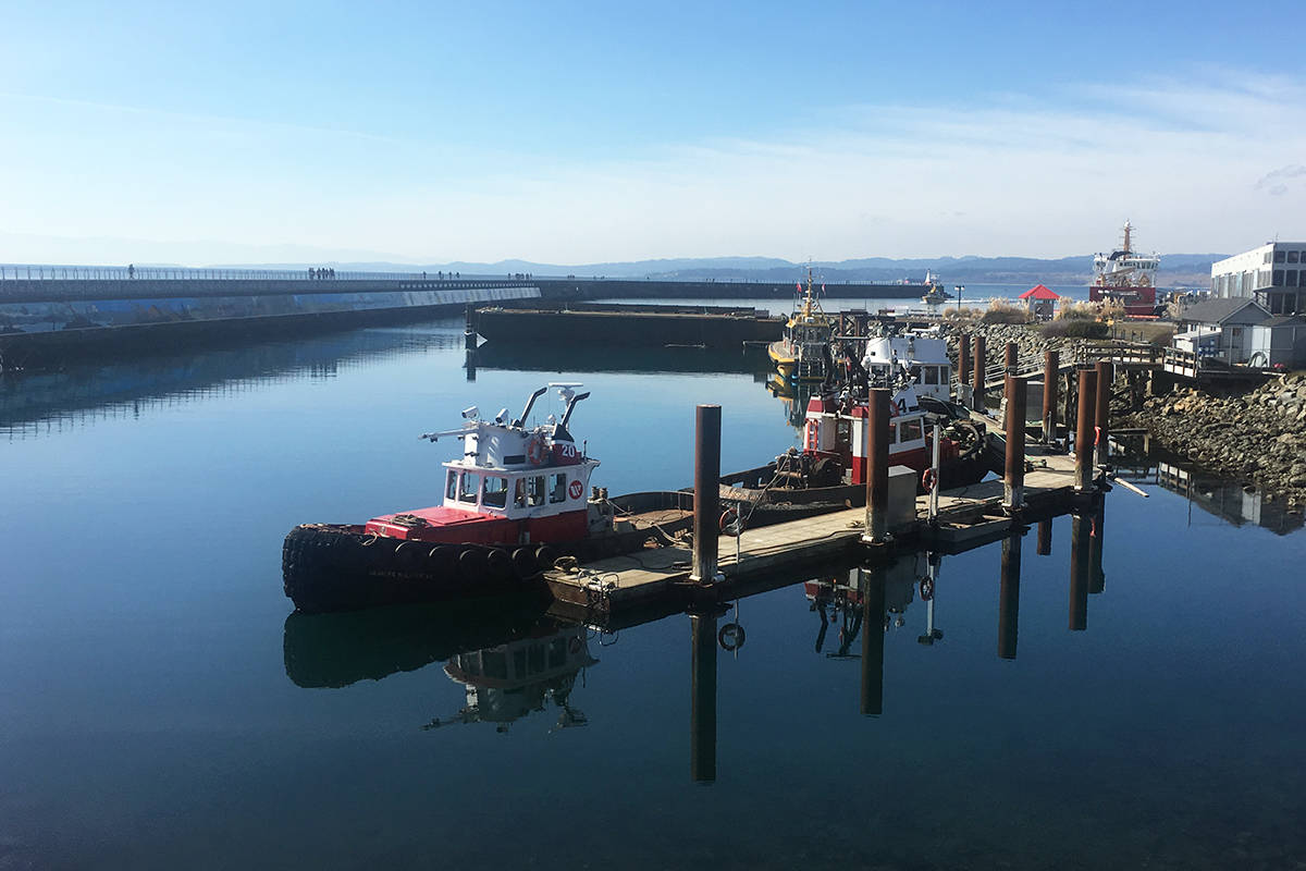 The Ogden Point breakwater and the Breakwater Barge (centre), host to musical events in summer, are two popular attractions in James Bay. Photo by Tess van Straaten