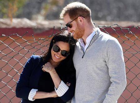 In this Sunday, Feb. 24, 2019 file photo, Britain’s Prince Harry and Meghan, Duchess of Sussex, watch children playing football at a school in the town of Asni, in the Atlas mountains, Morocco. The time is drawing near for the impending royal birth of the first child for Prince Harry and his wife Meghan, the Duchess of Sussex. The couple is keeping many details about Meghan’s pregnancy and birth plan private and say they don’t know the baby gender yet. (Facundo Arrizabalaga/Pool via AP, File)