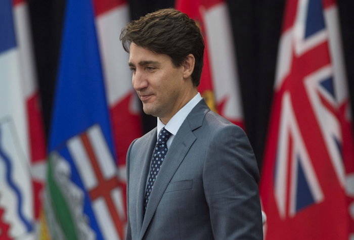 Canada Prime Minister Justin Trudeau makes his way to his seat at the start of the First Ministers Meeting in Ottawa, Tuesday, Oct. 3, 2017. (Adrian Wyld/The Canadian Press via AP)                                Canada Prime Minister Justin Trudeau makes his way to his seat at the start of the First Ministers Meeting in Ottawa, Tuesday, Oct. 3, 2017. (Adrian Wyld/The Canadian Press via AP)