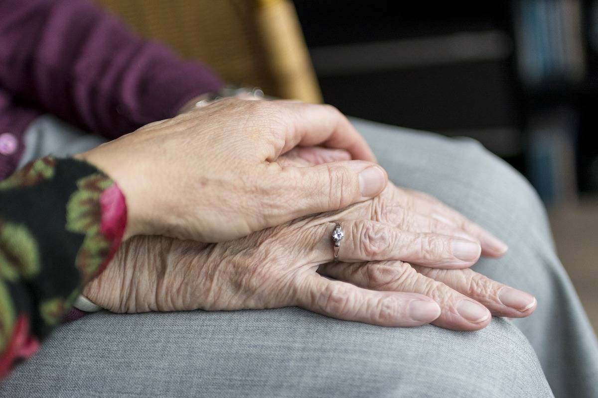 A family member comforts an elderly relative. Deathly Matters is an event looking at alternative views and services related to death and dying. (Pixabay File)