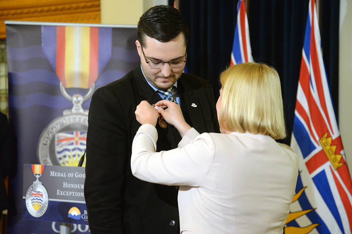 Brandon Laur of “The White Hatters,” received a Medal of Good Citizenship on behalf of his family. (Nina Grossman/Black Press)