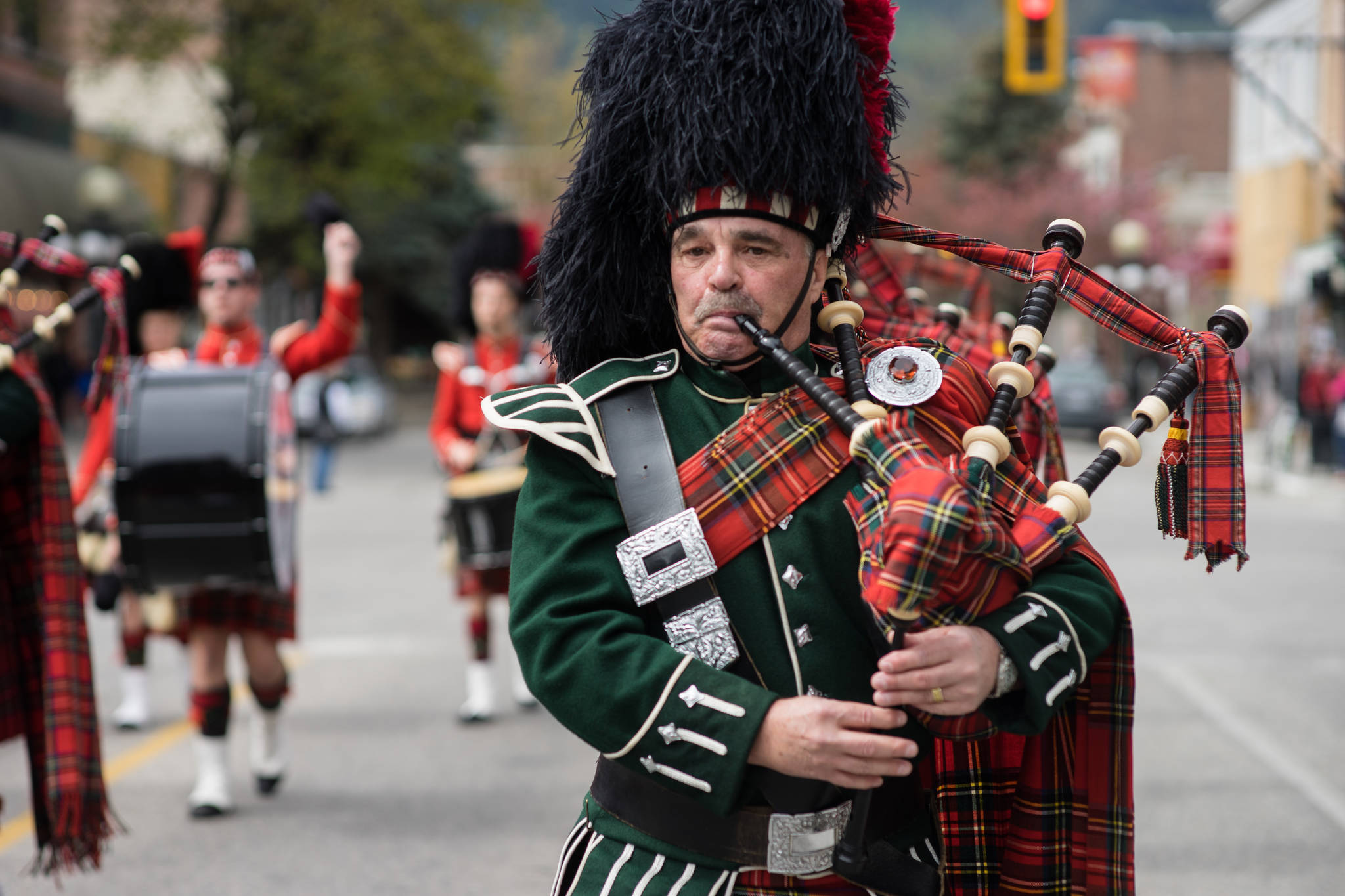 A member of the Trail pipe band marches along Baker Street during the annual Spring Fling on Saturday. Photo: Jake Sherman