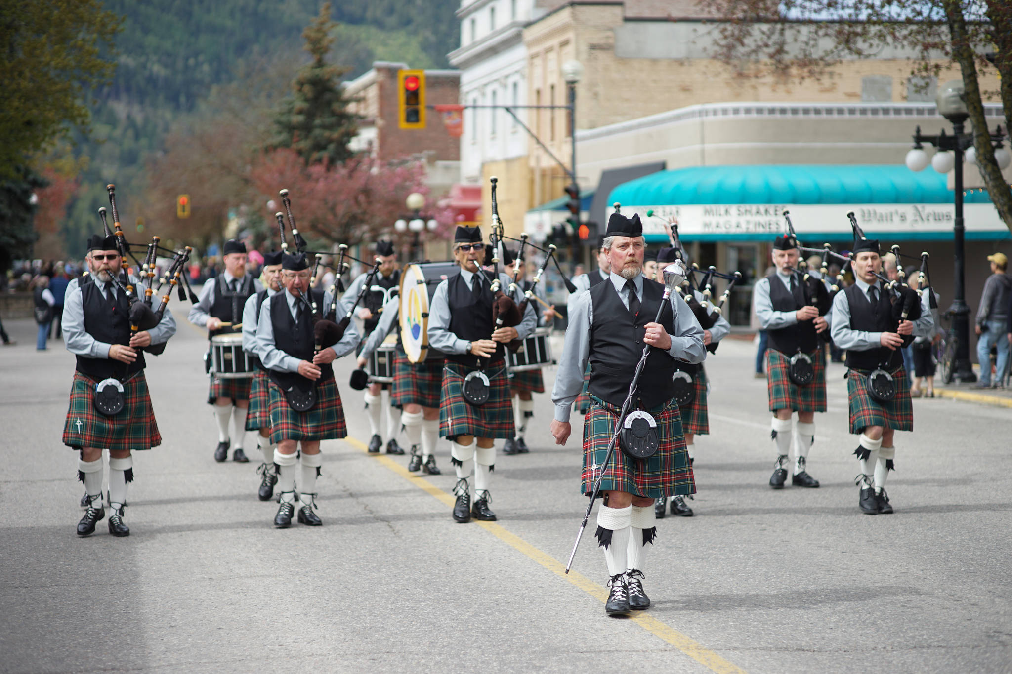 Drum major Ethan Whittla leads the Kelowna Pipe Band as they march along Baker Street during the annual spring fling. Photo: Jake Sherman