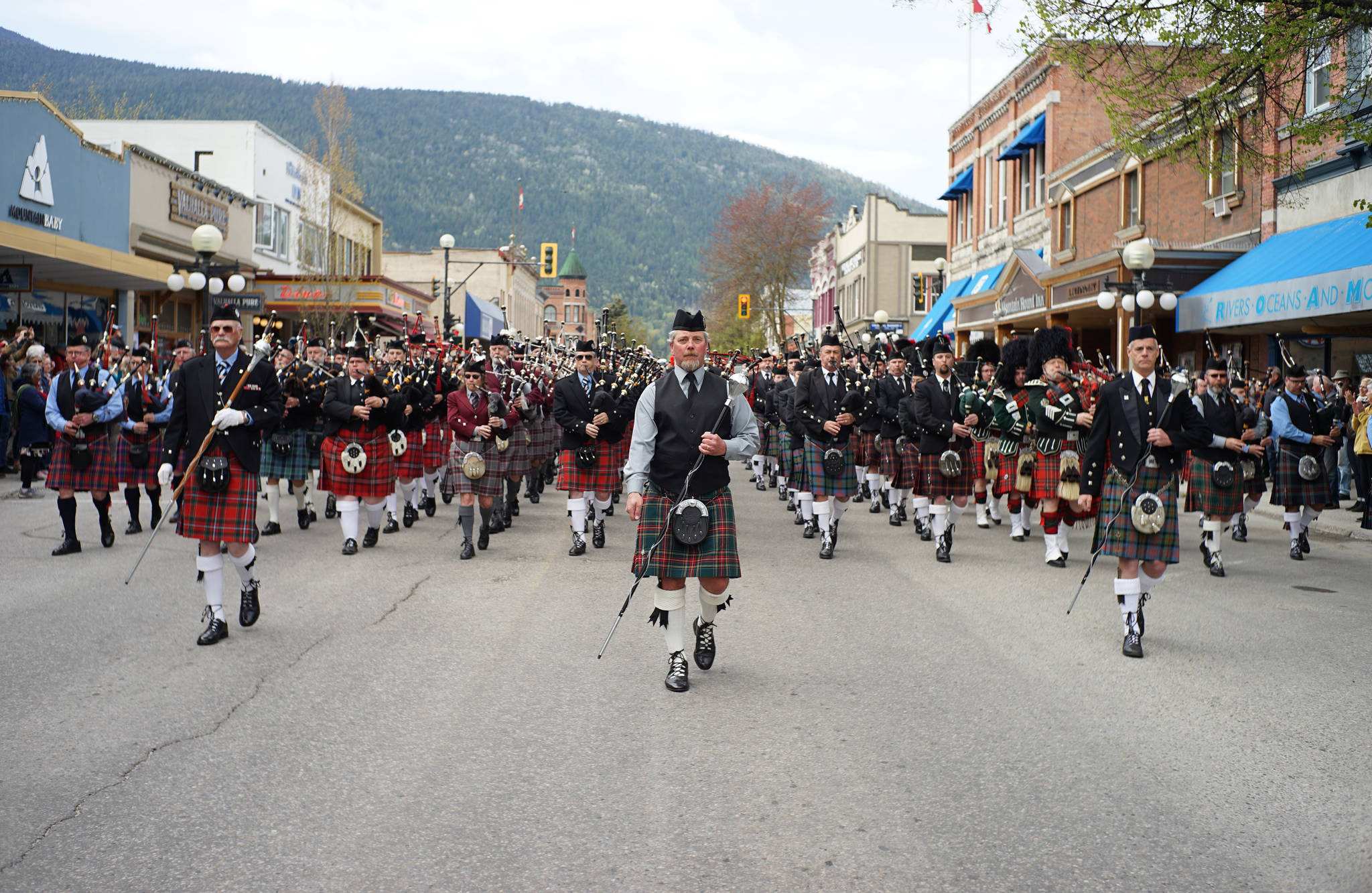Drum majors Bob Watson, of the Summerland Pipe Band, Niel Kay, of the Kamloops Pipe Band, and Ethan Whittla of the Kelowna Pipe Band, direct all 11 bands as they perform in honour of the Kootenay Kilte Pipe Bands 100th anniversary. Photos: Jake Sherman
