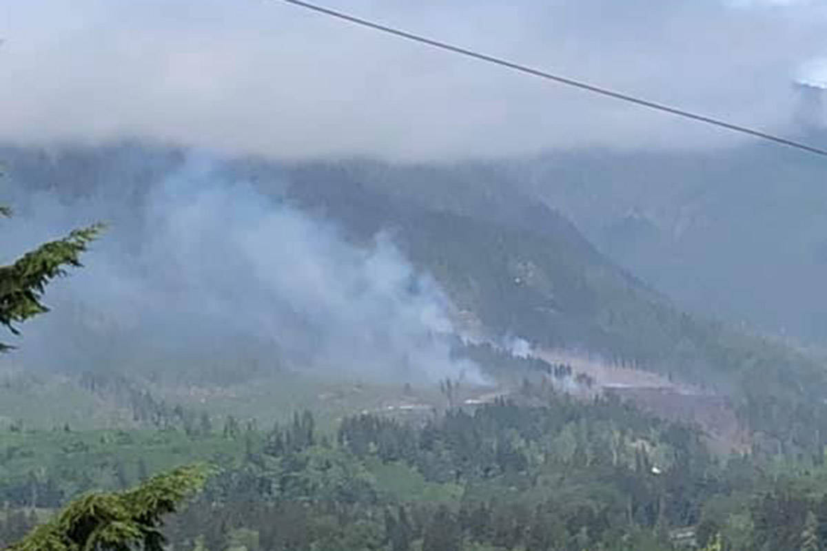 A photo taken by Sayward resident Ann Vansnick on the morning of May 11 shows smoke rising from a wildfire that reached 21 hectares, according to the BC Wildfire Service.