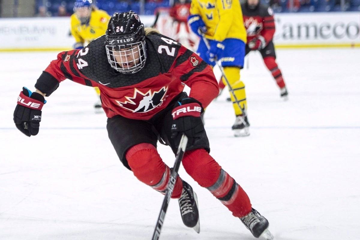 Canada forward Natalie Spooner moves the puck against Sweden during the second period of 2018 Four Nations Cup preliminary game in Saskatoon on Tuesday, November 6, 2018. Natalie Spooner dreams of a day when women’s professional hockey players won’t have to rush home from work to make it to practice. (THE CANADIAN PRESS/Liam Richards)