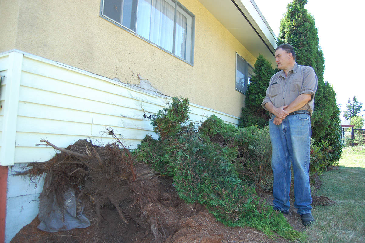 Campbell River resident Dale Proteau is shown outside his home on Alder Street after a pickup truck lost control, knocking over a tree and damaging the house, on June 14, 2019. Photo by David Gordon Koch/Campbell River Mirror