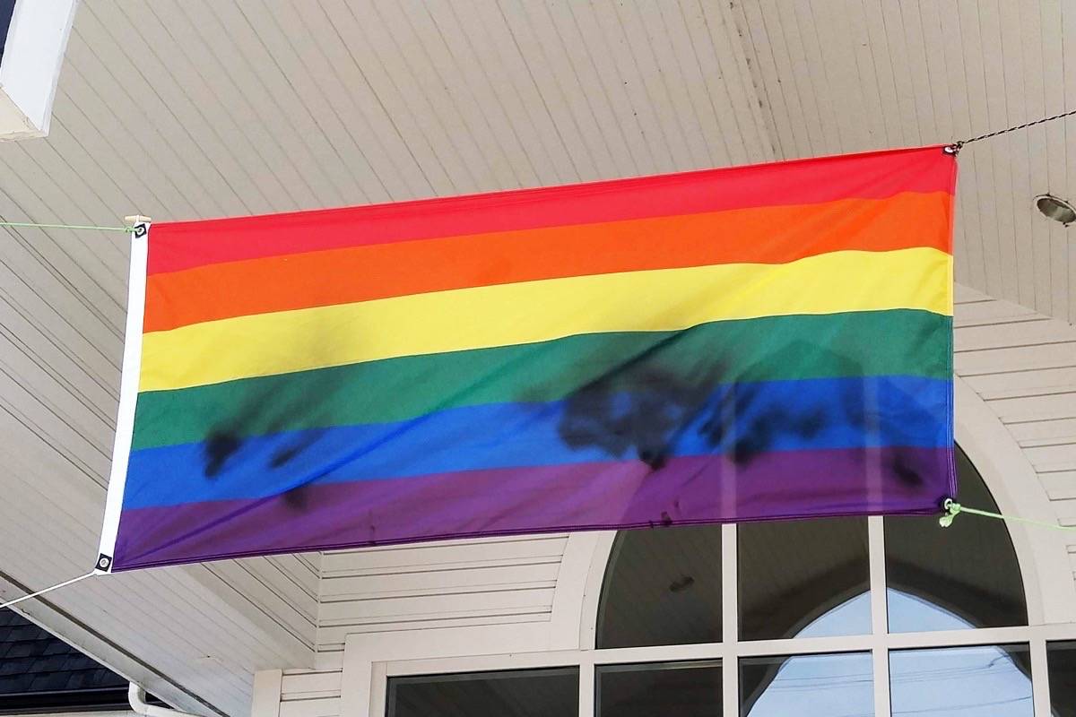 A Pride flag hanging outside Ladner United Church was found vandalized, again, on Saturday, June 15. It was the second time in 12 days the flag had been defaced. (James Smith photo)