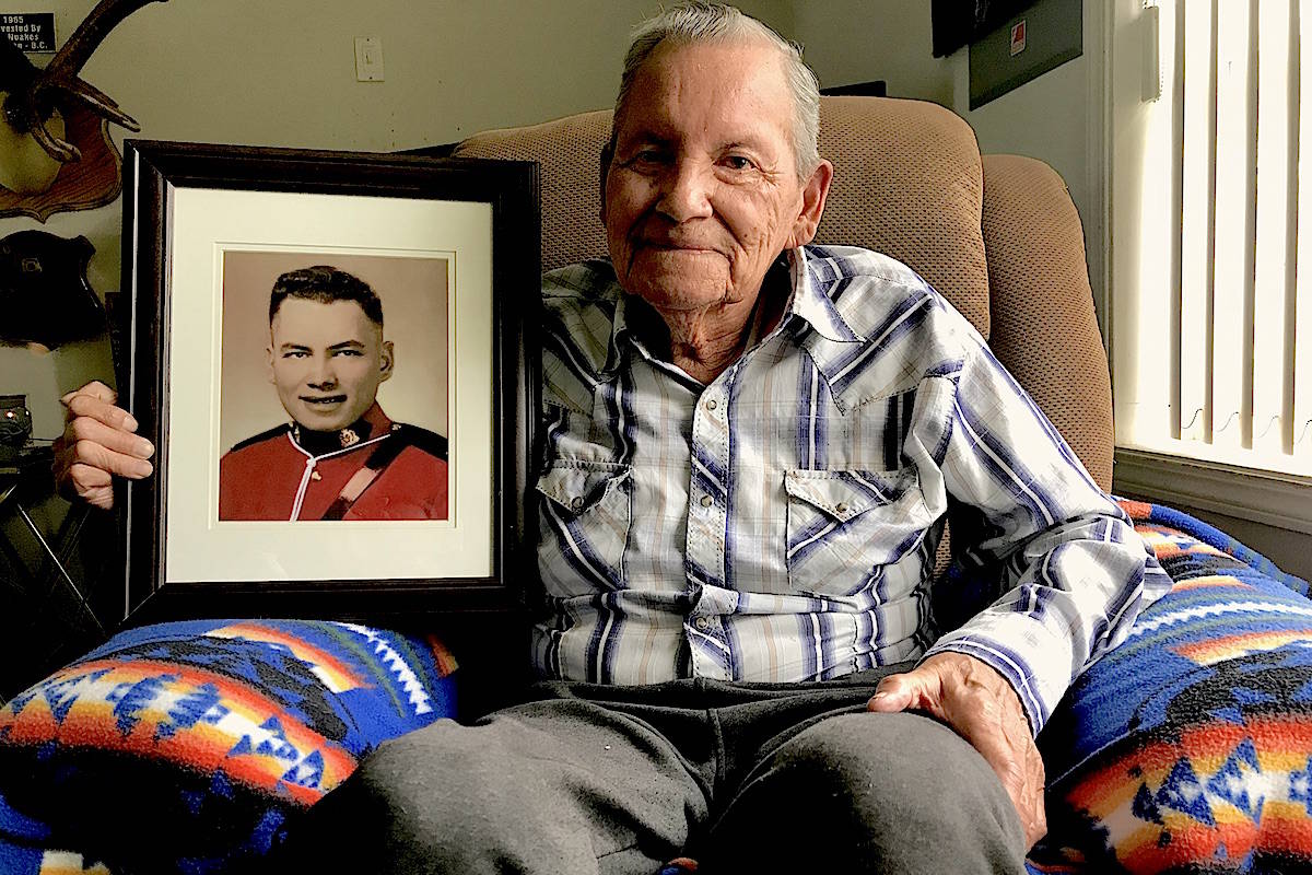 Ed Kelly holds his RCMP Depot graduation photo from 1959. (Jennifer Feinberg/ The Progress)