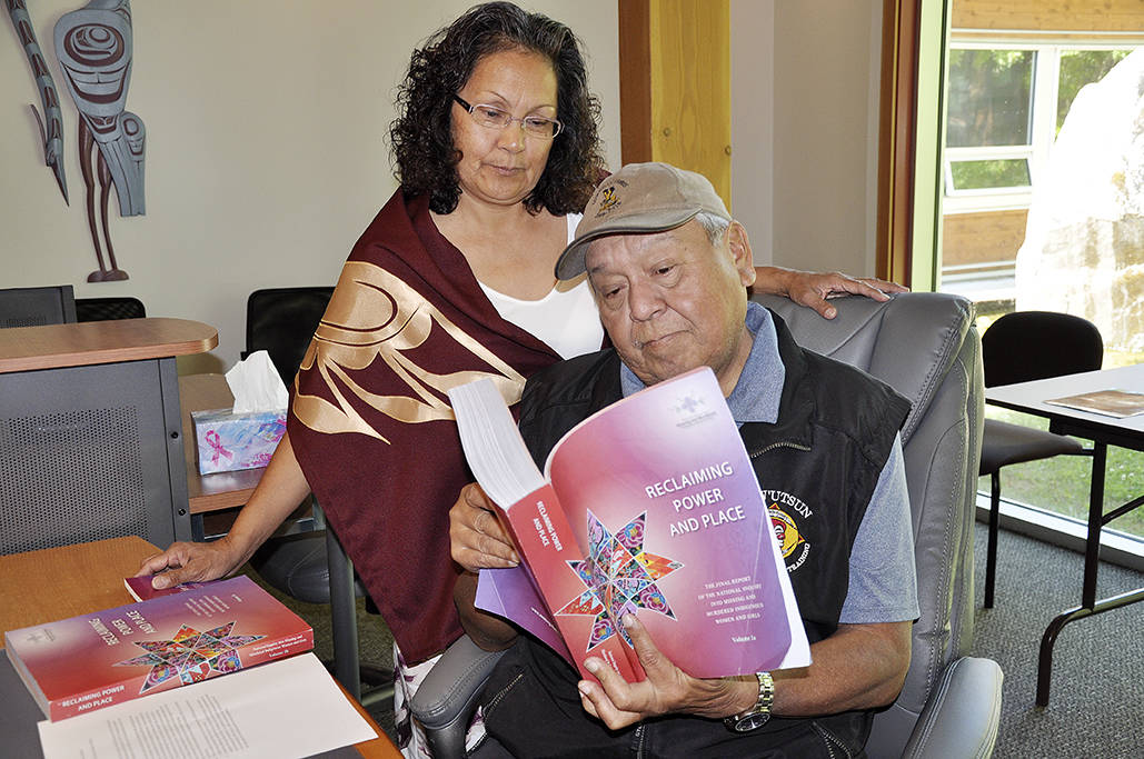 Patsy Jones and Chief William Seymour examine the final report from the National Inquiry into Missing and Murdered Indigenous Women and Girls. (Warren Goulding/Citizen)