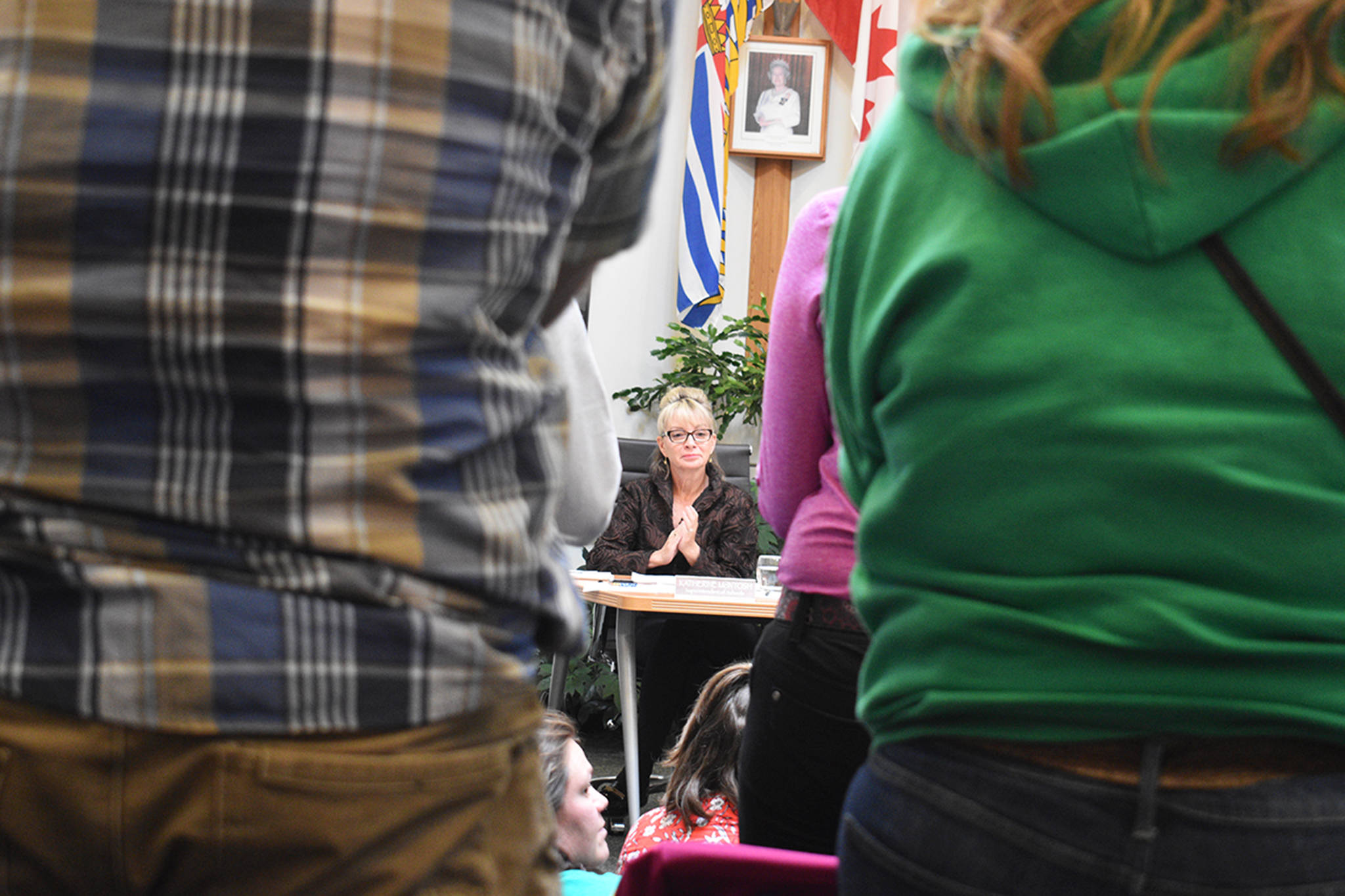Parents and community members stand and applaud after an emotional plea for the district to not reassign three popular administrators as superintendent Katherine McIntosh looks on at the crowd on June 19. (Brittany Gervais/Terrace Standard)