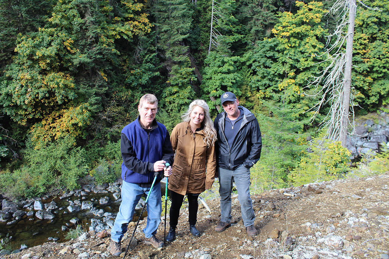 Wayne Jackaman, Jamie Constable, and Dave Burt, of the Jordan River Stewardship Roundtable standing on the contaminated soil at the edge of the Jordan River. (Contributed)
