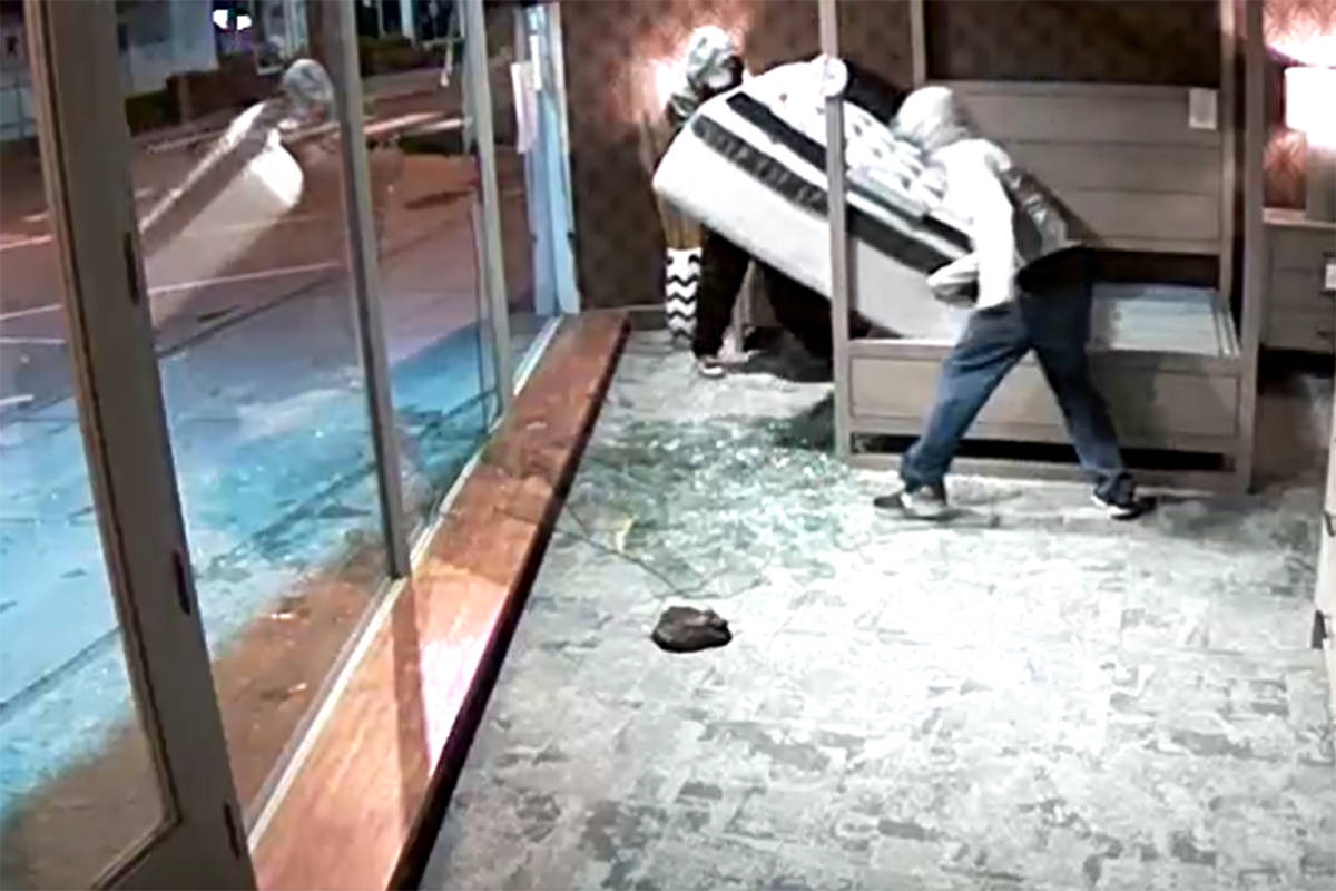 Still from a security video at the Bedroom Gallery on Wellington Avenue in Chilliwack. Thieves smashed the front windows and stole a mattress before 11 p.m. on July 7, 2019. (Facebook)