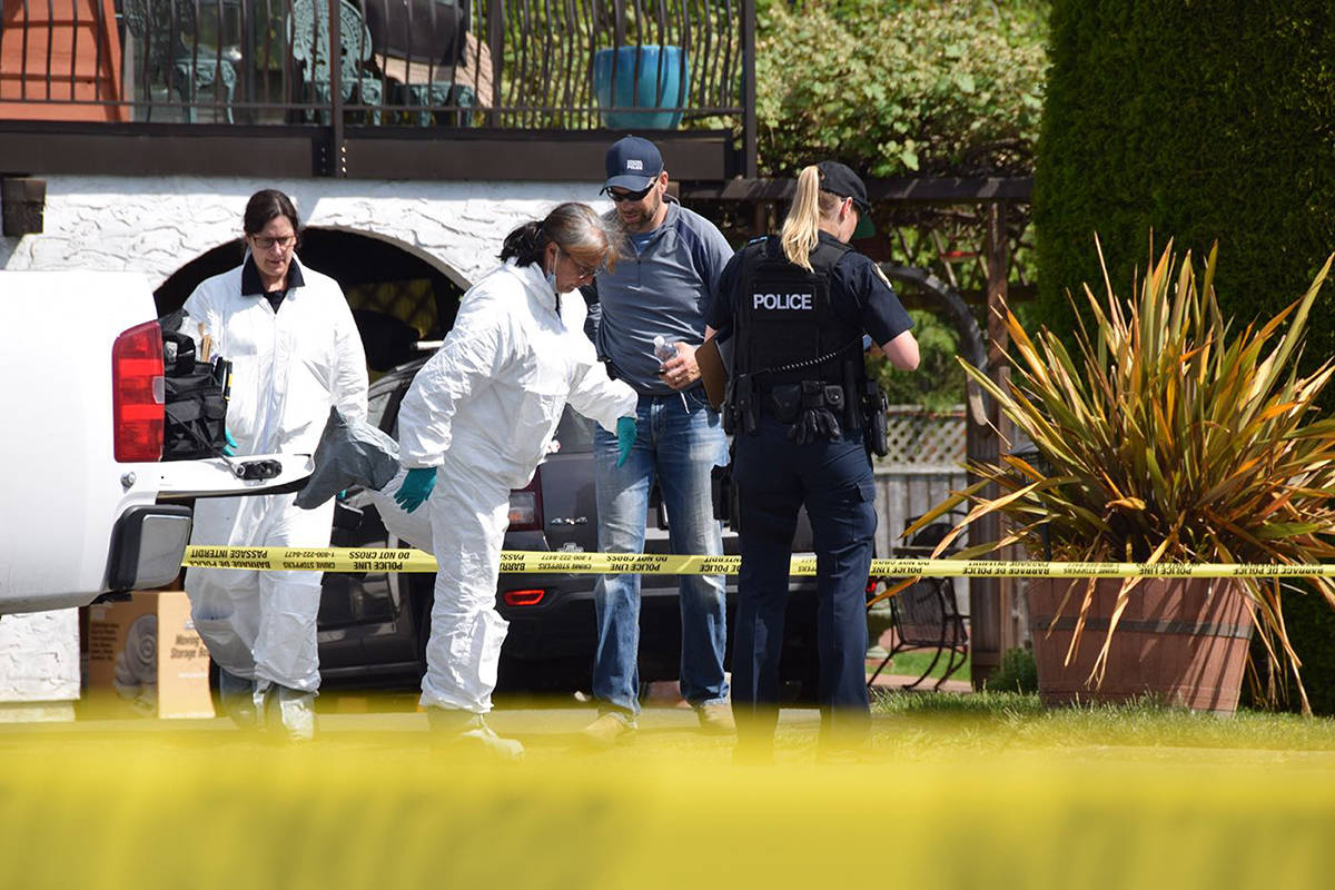 Investigators outside a home in Brentwood Bay on Saturday, May 11, 2019. (Keri Coles/Victoria News)