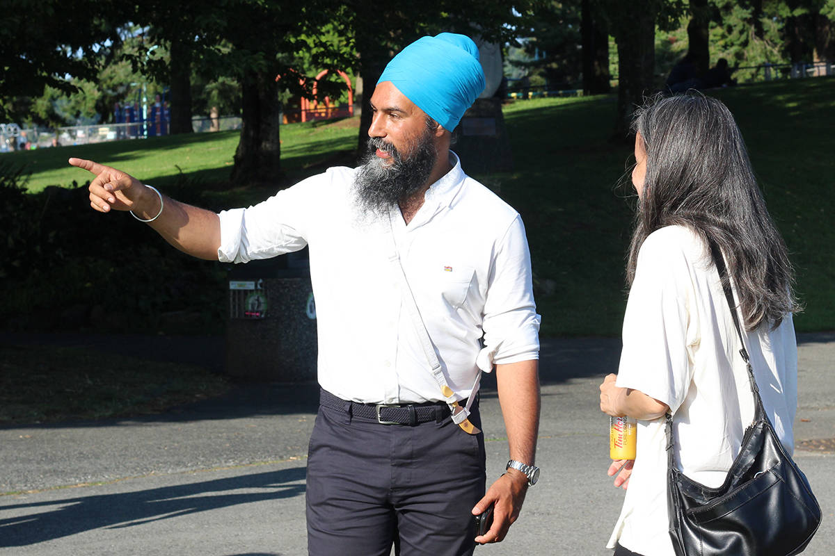 NDP leader Jagmeet Singh speaks with a voter on the Harbourfront Walkway at Maffeo Sutton Park on Monday in Nanaimo. (GREG SAKAKI/The News Bulletin)