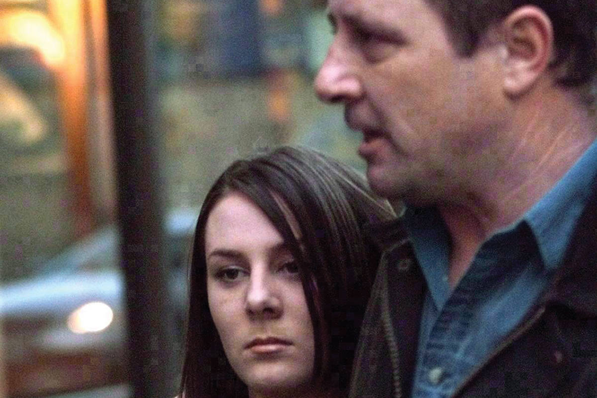 Kelly Ellard and her father leave the Vancouver courthouse. (Photo by THE CANADIAN PRESS)