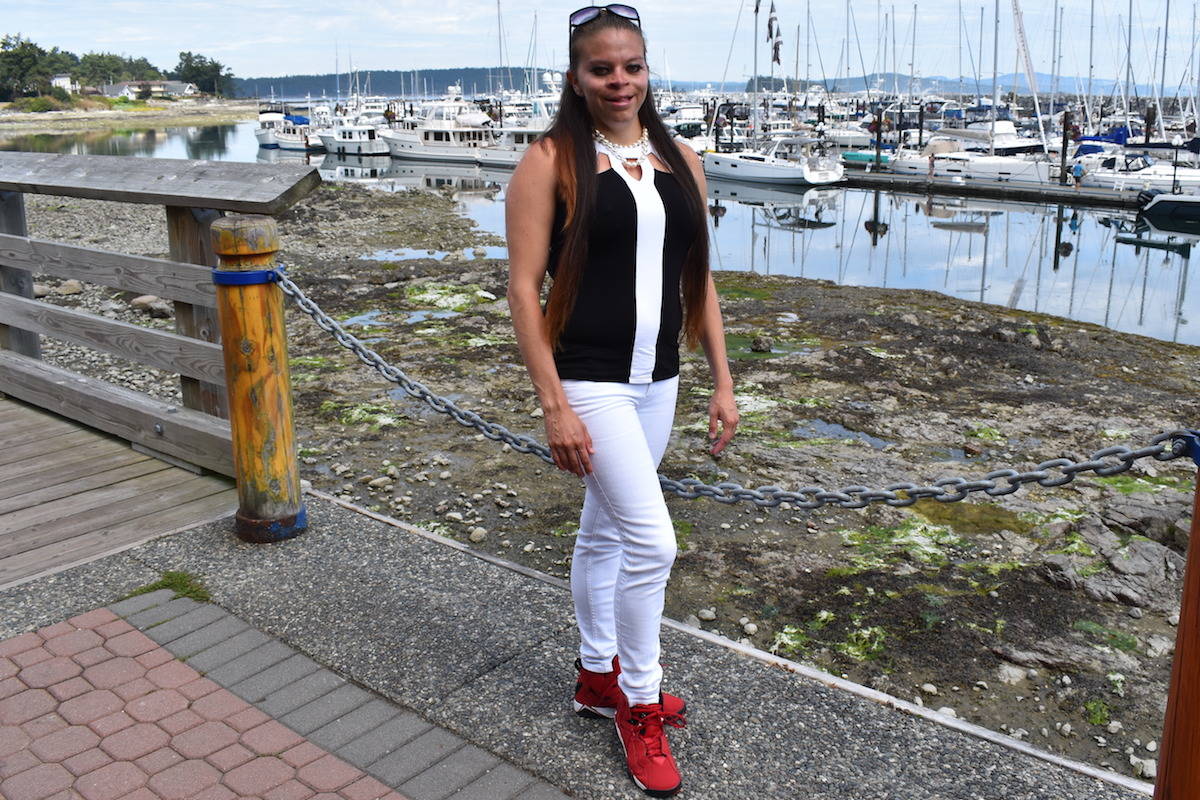Lauren Richardson, who is raising awareness for Fetal Alcohol Spectrum Disorder Awareness Day on Sept. 9 showcases her red shoes, a symbol of sufferers and their supporters. (Nick Murray/News Staff)