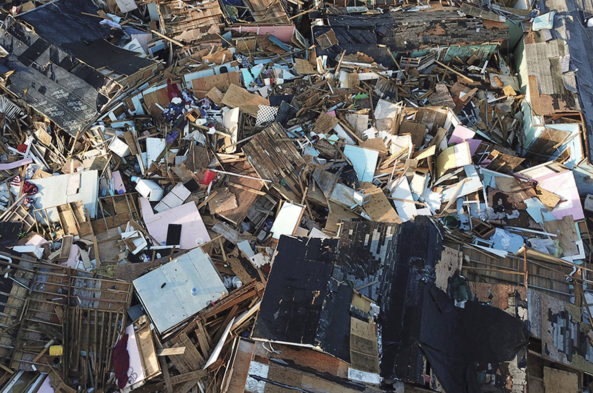 Homes lay in ruins one week after Hurricane Dorian hit The Mudd neighborhood, in the Marsh Harbor area of Abaco, Bahamas, Monday, Sept. 9, 2019. (AP Photo/Fernando Llano)