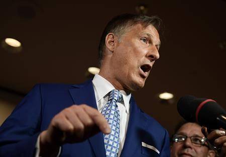 People’s Party of Canada leader Maxime Bernier speaks to reporters at the PPC National Conference in Gatineau, Que. on Sunday, Aug. 18, 2019. Bernier secured an invitation Monday to two official leaders’ debates in October. (THE CANADIAN PRESS/Justin Tang)