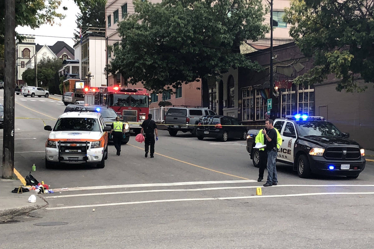The crime scene after the victims had been taken to hospital. Photo: Tyler Harper                                Police on scene of a stabbing in downtown Nelson, B.C. on Sept. 19, 2019. (Tyler Harper/Nelson Star)