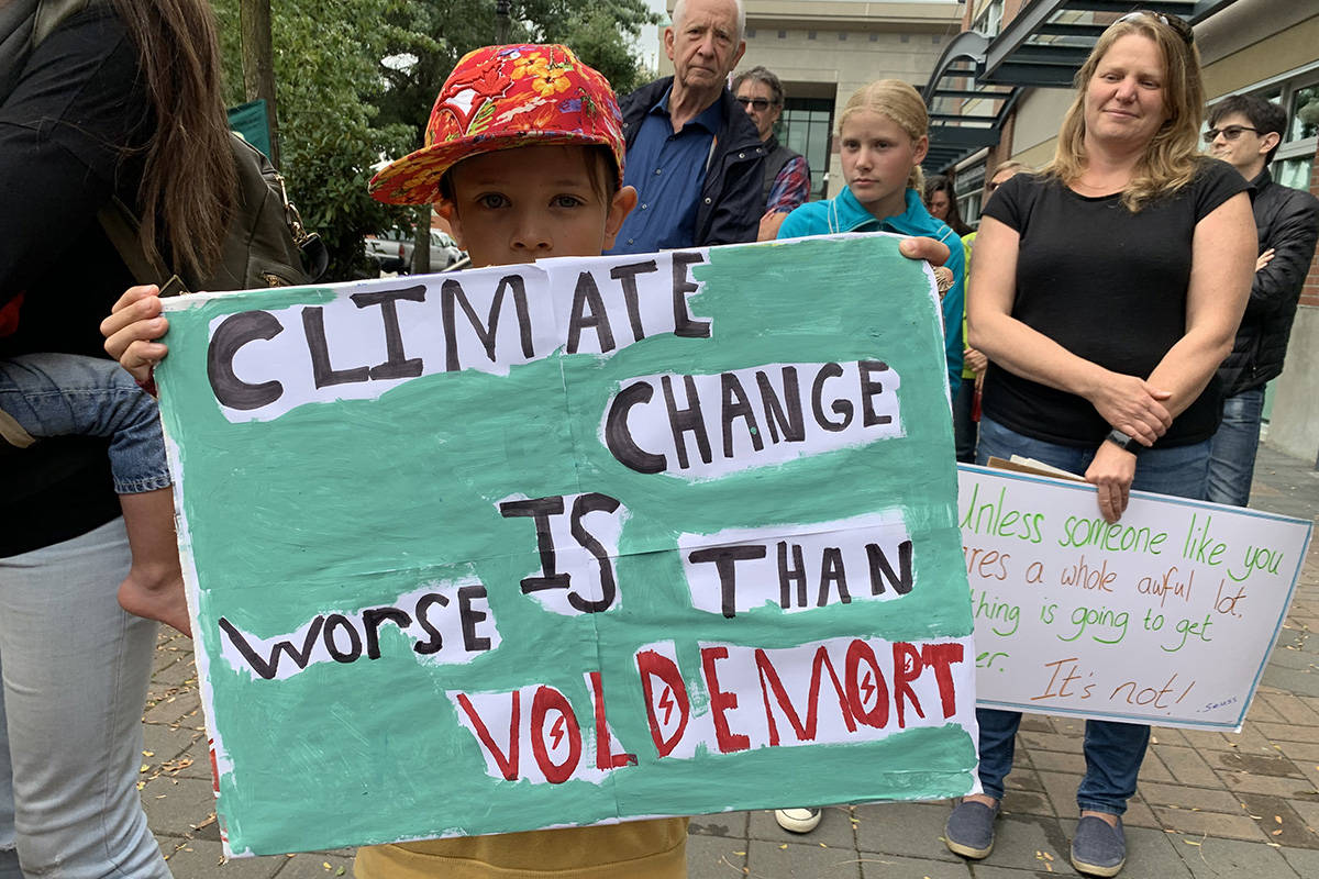 Young boy holds sign in Chilliwack, B.C. for Sept. 20, 2019 demonstration, demanding more action on climate change. (Paul Henderson/Chilliwack Progress)