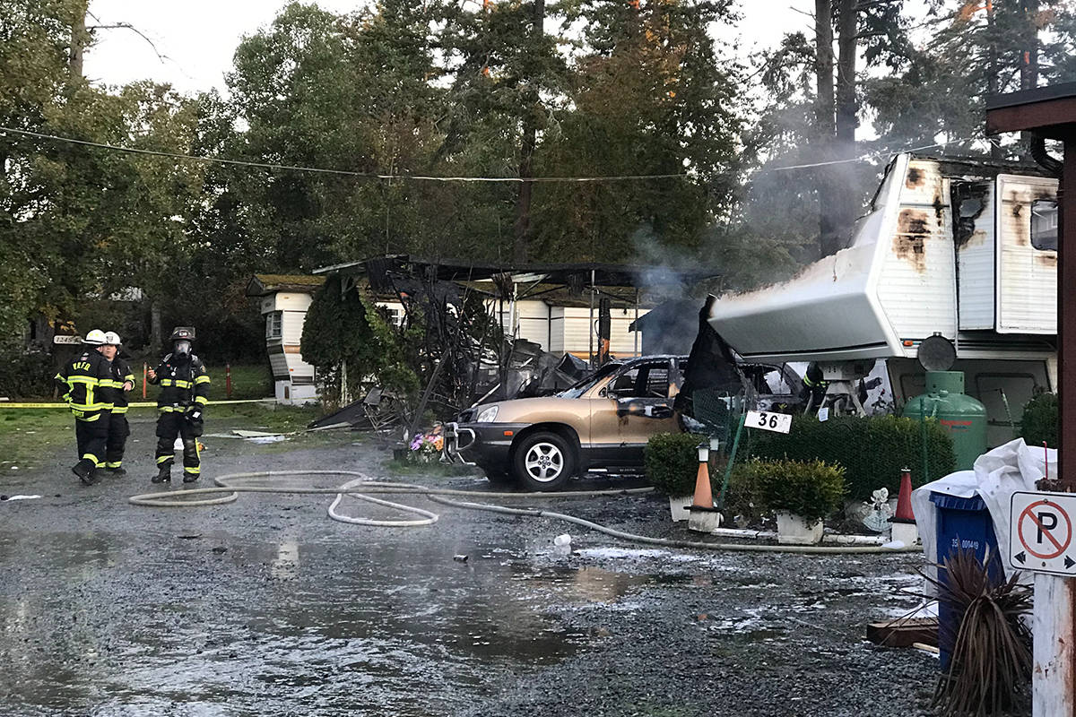 Three homes were damaged by an early morning fire on Craigflower Road. (Kendra Crighton/News Staff)