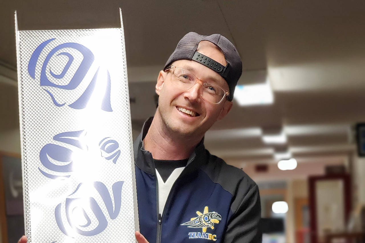 Artist Jamin Zuroski holds up one of his creations for his Indigenous Illuminations project. (File Contributed/ Jamin Zuroski)