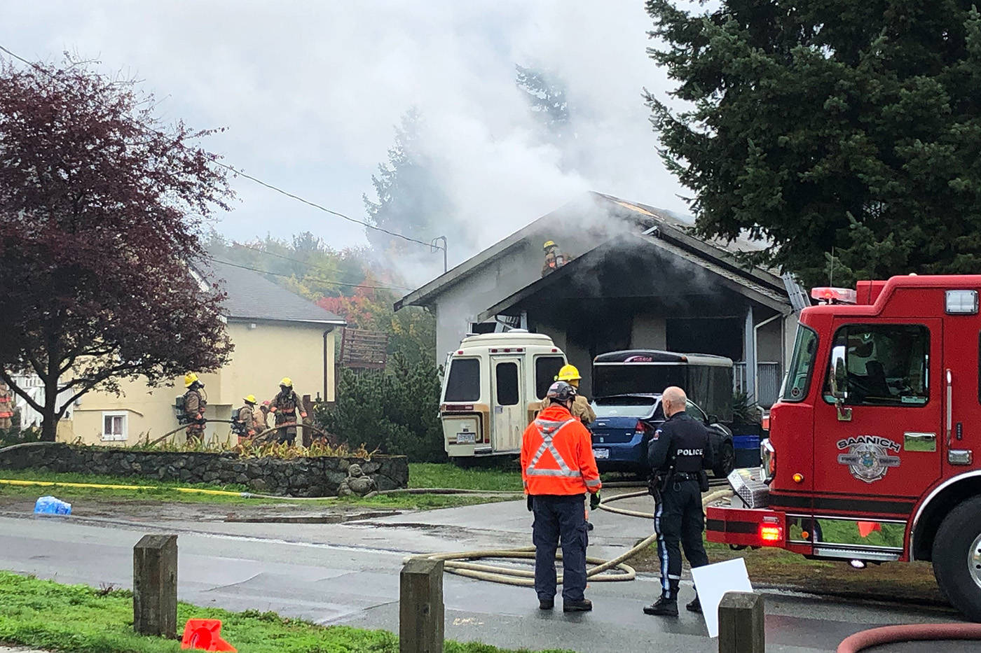 Crews respond to a house fire on Linwood Avenue in Saanich the morning of Oct. 18.(Devon Bidal/News Staff)