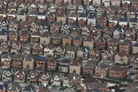 Aerial view of houses in Oshawa, Ont., seen from a Canadian forces Hercules on Saturday, Nov. 11, 2017. The federal election results mean potential new barriers for foreign real estate investors as well as some help for first time buyer, but not the more significant changes that opposition parties had promised. (THE CANADIAN PRESS/Lars Hagberg)