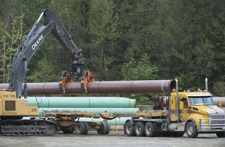 FILE - Pipeline pipes are seen at a Trans Mountain facility near Hope, B.C., Thurs., Aug. 22, 2019. A newly re-elected Prime Minister Justin Trudeau said on Wed., Oct. 23, 2019 that he wants to build the Trans Mountain pipeline expansion quickly. (Jonathan Hayward / The Canadian Press)
