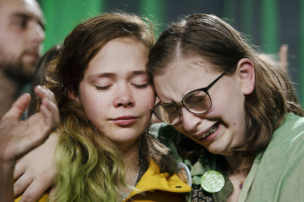 Two young David Merner supporters cry in the aftermath of the election at the Green Party of Canada’s election night party at the Crystal Gardens in Victoria. (Arnold Lim/Black Press)