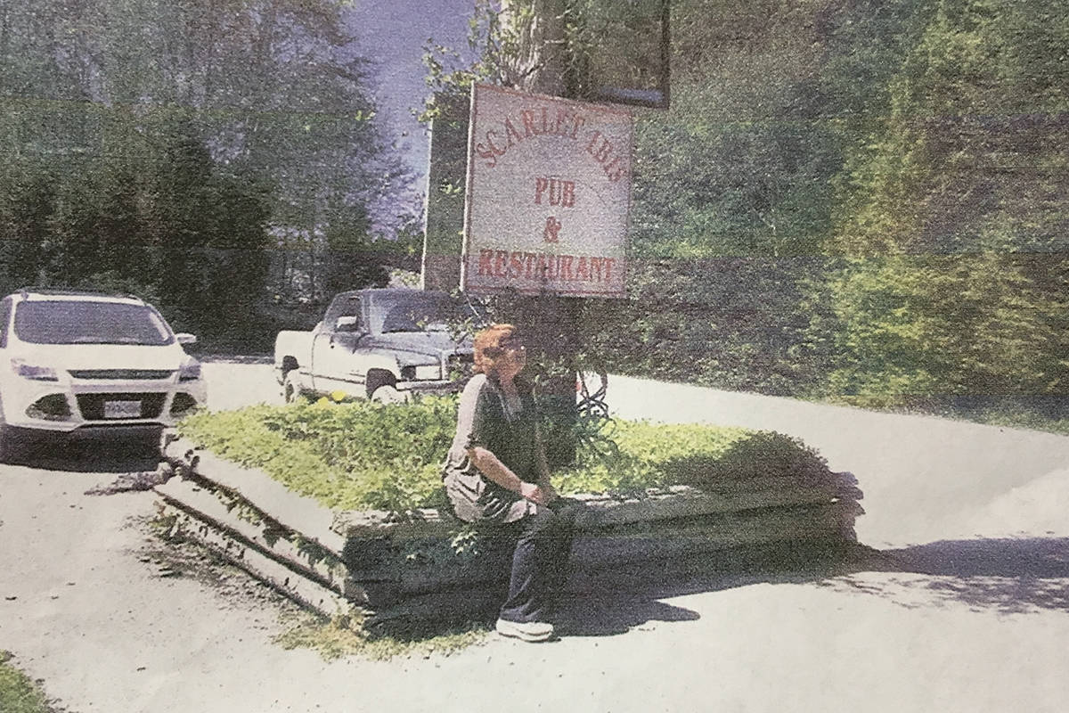 SUBMITTED PHOTO                                An undated archive photo of Patricia Gwynne sitting outside of the Scarlet Ibis Pub.