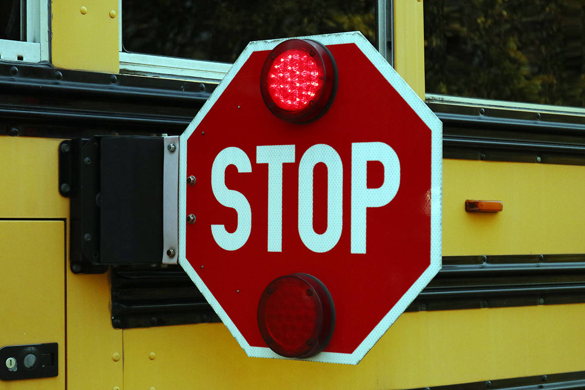 Motorists must stop when the red lights on the school bus are flashing. (Lexi Bainas/Citizen)