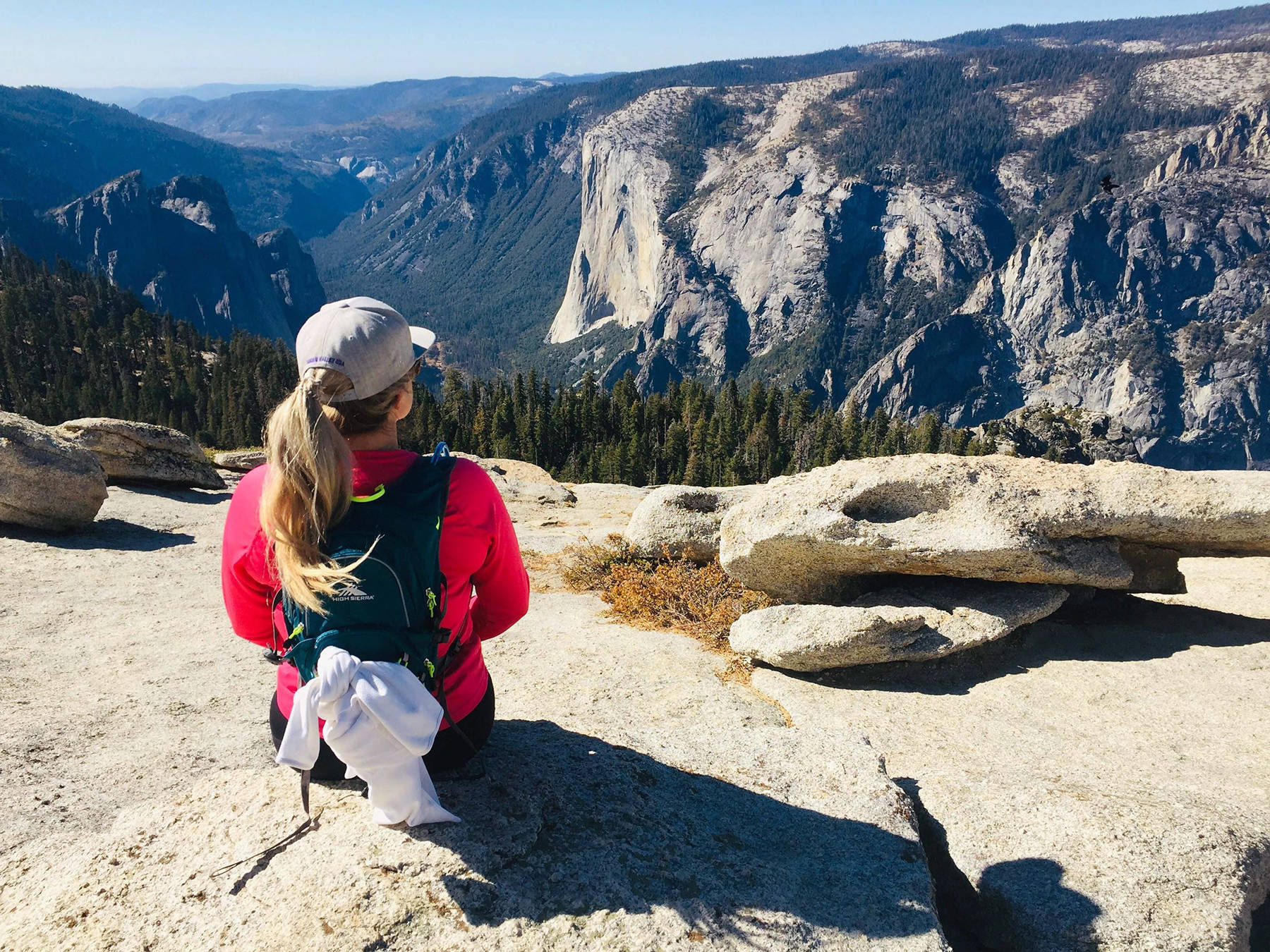 This Oct. 20, 2019 photo shows Karen Tara, of San Francisco, soaking in the views of El Capitan from the top of Sentinel Dome in Yosemite National Park. (AP Photo/Amanda Lee Myers)