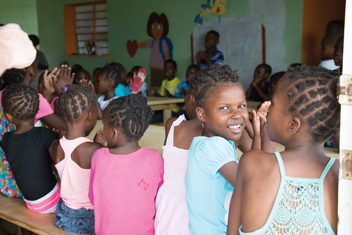 Children piled into the Divine Hands Orphanage near Port-au-Prince, Haiti, singing a song to welcome a team of Rotary volunteers. (Black Press Media file photo)