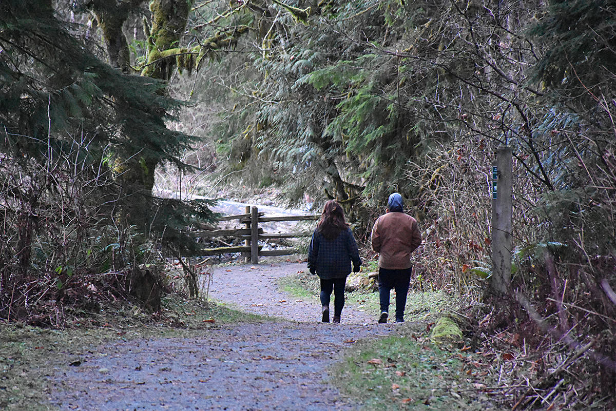 Volunteers are helping to search the area trails. (Neil Corbett/THE NEWS)