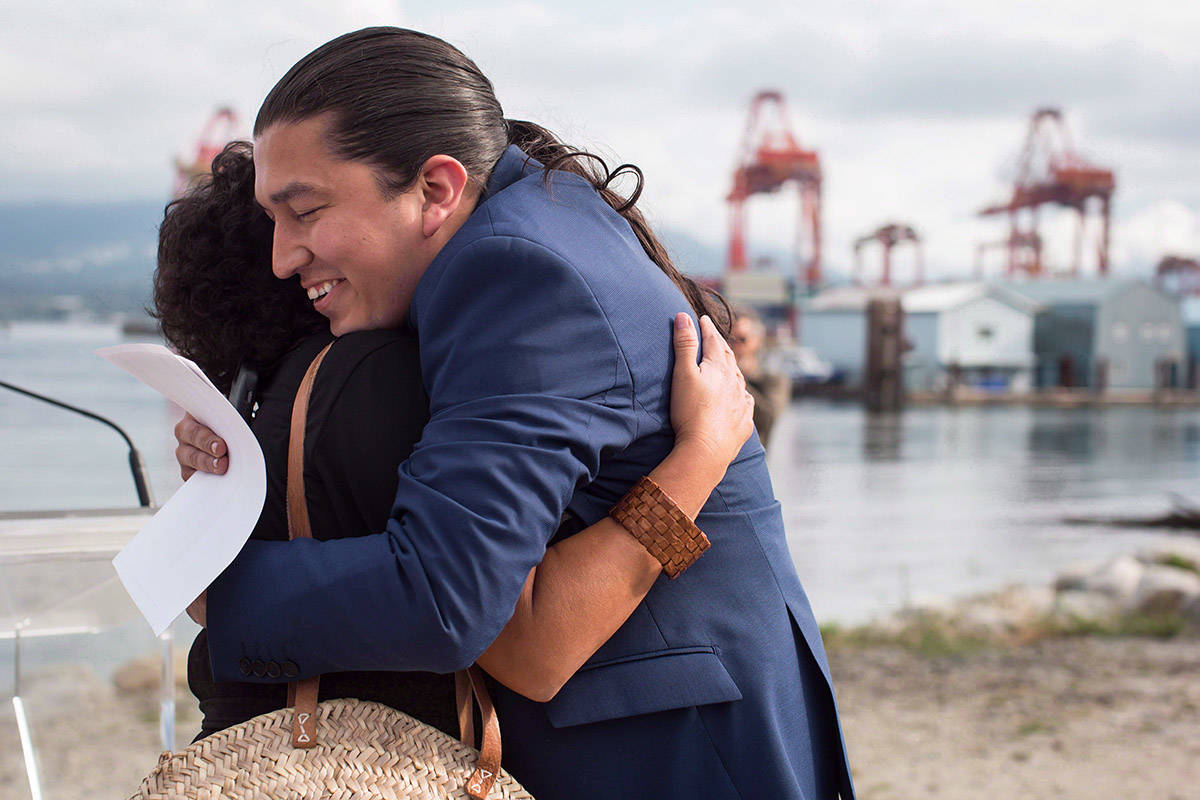 Khelsilem (Dustin Rivers), right, elected councillor and spokesperson for Squamish Nation, embraces Tsleil-Waututh Nation councillor Charlene Aleck in celebration before First Nations leaders respond to a Federal Court of Appeal ruling on the Kinder Morgan Trans Mountain Pipeline expansion, during a news conference in Vancouver on August 30, 2018. THE CANADIAN PRESS/Darryl Dyck