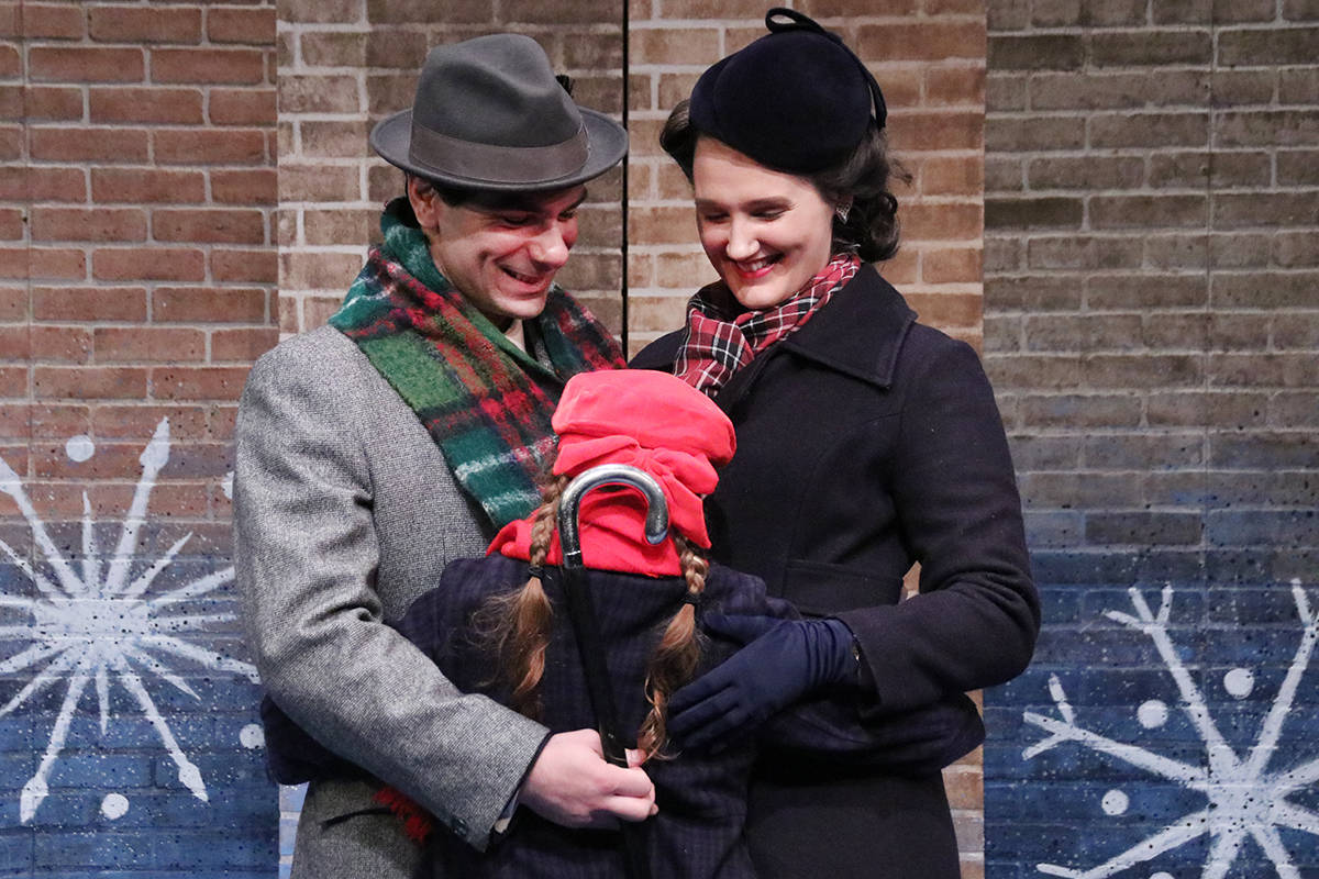 Right: Fred (Abraham Asto), Doris (Michelle Morris) and Susan (Julianna Toft) enjoy a group hug when they realize they are going to be a family with a house in the country.