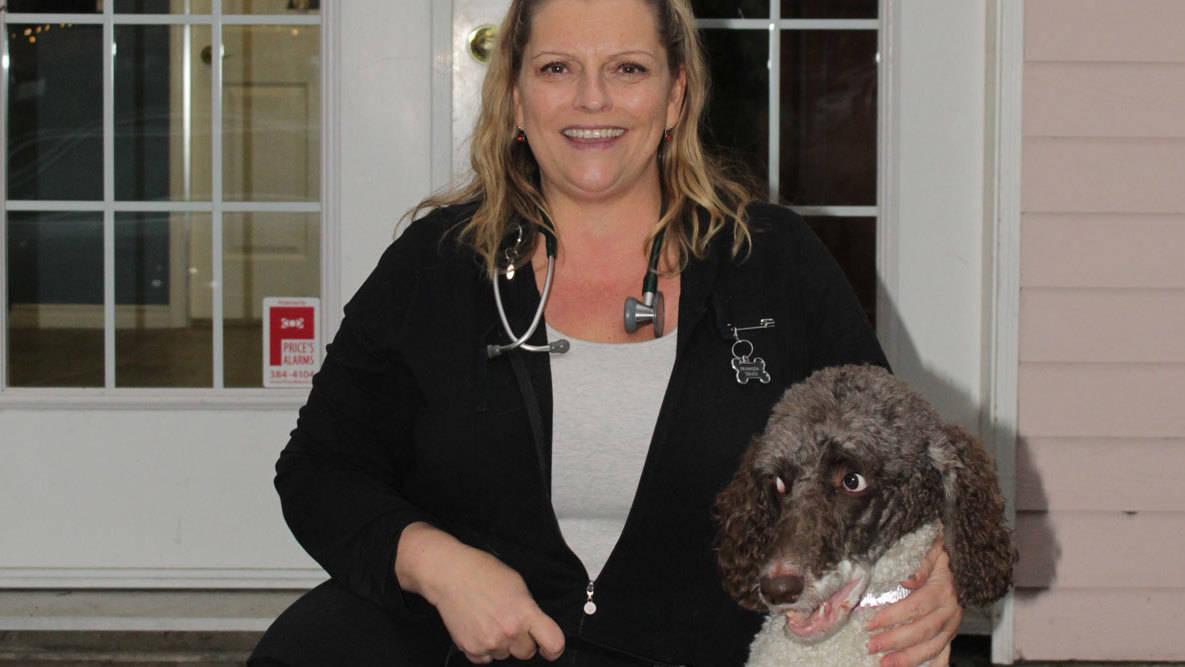 Magda Szajcz, a Saanich veterinarian, brings Salmon, her parti coloured poodle, to work with her every day. (Devon Bidal/News Staff)