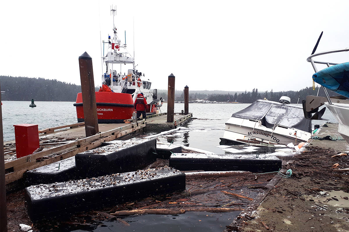 The French Creek Base of the Coast Guard was called in to the Beachcomber Marina in Nanoose Bay on Sunday, Jan. 12 for a severe windstorm. Crews returned on Monday to help clean up the damage done to the marina and boats. (Emily Vance photo)