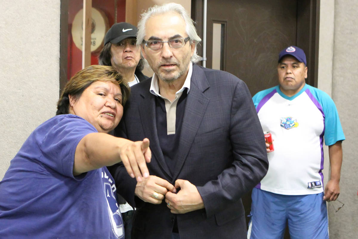 Polly Jack directs national Aboriginal figure Phil Fontaine to his seat at a meeting on the subject of Indian Day Schools in Duncan in 2011. (Lexi Bainas/Citizen)