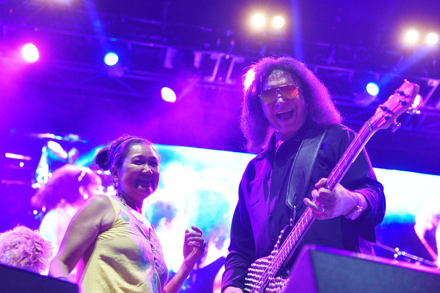 Gene Simmons dances with guests onstage at CannaFest 2018.                                (Kathleen Saylors/Grand Forks Gazette)