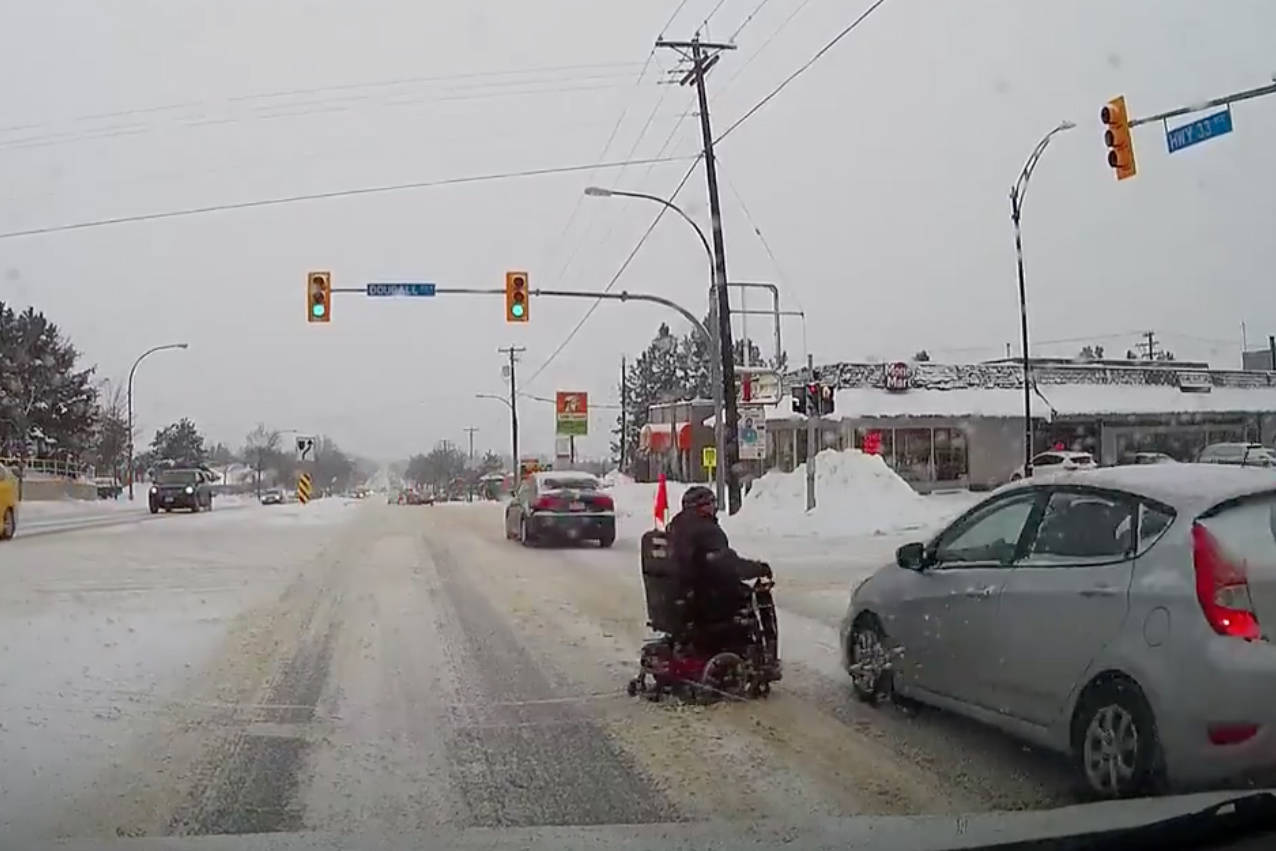 VIDEO: Person in wheelchair narrowly avoids collision with car in Kelowna